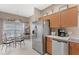 Bright kitchen with stainless steel appliances and breakfast nook at 2220 Wyndham Palms Way, Kissimmee, FL 34747
