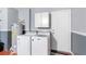 Laundry room with washer, dryer, and cabinets at 2220 Wyndham Palms Way, Kissimmee, FL 34747