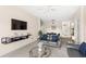 Living room with gray sofa and glass coffee table at 2220 Wyndham Palms Way, Kissimmee, FL 34747