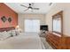 Spacious main bedroom with a king-size bed and dresser at 2220 Wyndham Palms Way, Kissimmee, FL 34747