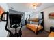Bright bedroom with a bunk bed and elliptical machine at 236 Captiva Dr, Davenport, FL 33896