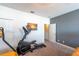 Bedroom with elliptical machine and adjacent room access at 236 Captiva Dr, Davenport, FL 33896