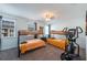 Bedroom with twin bunk beds and elliptical machine at 236 Captiva Dr, Davenport, FL 33896