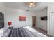King bedroom with TV and ensuite bathroom access at 236 Captiva Dr, Davenport, FL 33896