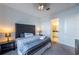 Main bedroom with king bed and en-suite bathroom at 236 Captiva Dr, Davenport, FL 33896