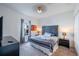 King-size bed in a well lit bedroom with an ensuite bathroom at 236 Captiva Dr, Davenport, FL 33896