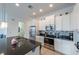 Modern kitchen with stainless steel appliances and white shaker cabinets at 236 Captiva Dr, Davenport, FL 33896