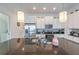 Bright kitchen with white cabinets, granite countertops, and stainless steel appliances at 236 Captiva Dr, Davenport, FL 33896