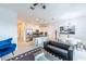 Open floor plan boasts a modern kitchen with stainless steel appliances and adjacent living room at 236 Captiva Dr, Davenport, FL 33896