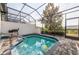 Relaxing screened-in pool and patio area at 236 Captiva Dr, Davenport, FL 33896