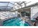 Private screened-in pool with patio and grill at 236 Captiva Dr, Davenport, FL 33896