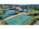 Aerial view of community amenities including tennis courts, basketball court, pool, and clubhouse at 2545 Volta Cir, Kissimmee, FL 34746