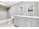 Modern bathroom featuring double sink vanity, tiled shower, and stylish fixtures at 2901 Primrose Ct, Orlando, FL 32803
