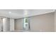 Bedroom with a gray paint scheme, large window with curtains and white trim at 2901 Primrose Ct, Orlando, FL 32803