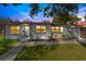 Inviting single-story home with fresh landscaping, offering a warm welcome and curb appeal at dusk at 2901 Primrose Ct, Orlando, FL 32803