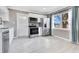 Bright kitchen features stainless steel appliances, white cabinetry, and a window at 2901 Primrose Ct, Orlando, FL 32803