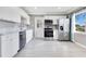 Bright kitchen features stainless steel appliances, white cabinetry, and a window at 2901 Primrose Ct, Orlando, FL 32803
