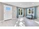 Bright living room featuring light gray walls and tile flooring at 2901 Primrose Ct, Orlando, FL 32803