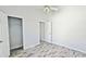 Bedroom with wood-look floors, neutral walls and a closet at 337 Silver Palms Cir, Davenport, FL 33837