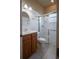 Clean bathroom with shower, toilet and wood vanity at 38633 Lakeview Walk, Lady Lake, FL 32159