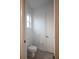 Simple bathroom with toilet and door at 38633 Lakeview Walk, Lady Lake, FL 32159