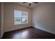 Spacious bedroom with dark hardwood floors and window blinds at 38633 Lakeview Walk, Lady Lake, FL 32159