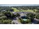 Aerial view of a clubhouse with a golf course in the background at 38633 Lakeview Walk, Lady Lake, FL 32159