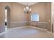 Bright dining room with a chandelier and tile floors at 38633 Lakeview Walk, Lady Lake, FL 32159
