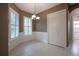 Charming dining area with wainscoting and window shutters at 38633 Lakeview Walk, Lady Lake, FL 32159