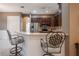 Well-equipped kitchen with stainless steel appliances and breakfast bar at 38633 Lakeview Walk, Lady Lake, FL 32159