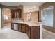 Modern kitchen with stainless steel appliances and dark wood cabinets at 38633 Lakeview Walk, Lady Lake, FL 32159