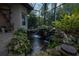 Stunning koi pond with waterfall and tranquil ambiance at 38633 Lakeview Walk, Lady Lake, FL 32159