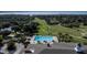 Community pool with lounge chairs and a spa at 38633 Lakeview Walk, Lady Lake, FL 32159