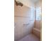 Large walk-in shower with tiled walls and seat at 38633 Lakeview Walk, Lady Lake, FL 32159