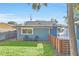 Side yard with grassy lawn and wooden fence at 413 W Princeton St, Orlando, FL 32804