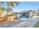 Home's side yard with driveway and wooden fence at 413 W Princeton St, Orlando, FL 32804