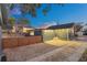 Backyard view at dusk with detached garage and fence at 413 W Princeton St, Orlando, FL 32804