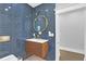 Stylish bathroom with a floating vanity and blue tile at 413 W Princeton St, Orlando, FL 32804