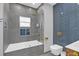 Modern bathroom with a large walk-in shower and grey tile at 413 W Princeton St, Orlando, FL 32804