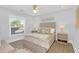 Bright bedroom with plush bed, wood floors, and window coverings at 413 W Princeton St, Orlando, FL 32804