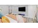 Comfortable bedroom with a large TV and plenty of closet space at 413 W Princeton St, Orlando, FL 32804