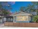 Charming craftsman home with gray siding, a modern fence, and large windows at 413 W Princeton St, Orlando, FL 32804