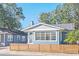 Charming craftsman home with a modern wooden fence at 413 W Princeton St, Orlando, FL 32804