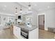 Open concept kitchen with breakfast bar and view into the living room at 413 W Princeton St, Orlando, FL 32804