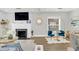 Bright living room with stylish seating and a modern fireplace at 413 W Princeton St, Orlando, FL 32804