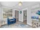 Bright sunroom with a view and access to the front door at 413 W Princeton St, Orlando, FL 32804