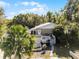 Single story home with deck, landscaping, and walkway at 459 & 461 W Desoto St, Clermont, FL 34711