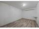 An empty spare room with white block walls and laminate wood flooring at 459 & 461 W Desoto St, Clermont, FL 34711