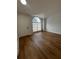 Bright living room with new flooring and large arched window at 581 Calusa Ter, Deltona, FL 32738