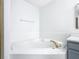Relax in this updated bathroom, featuring a corner bathtub and modern vanity at 604 Elfrida Way, Kissimmee, FL 34758